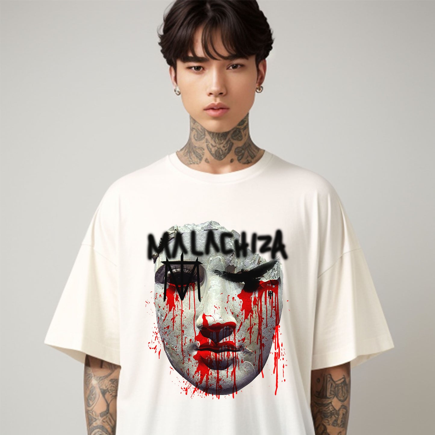 Male model wearing an oversized vintage white t-shirt featuring a digitally printed design.